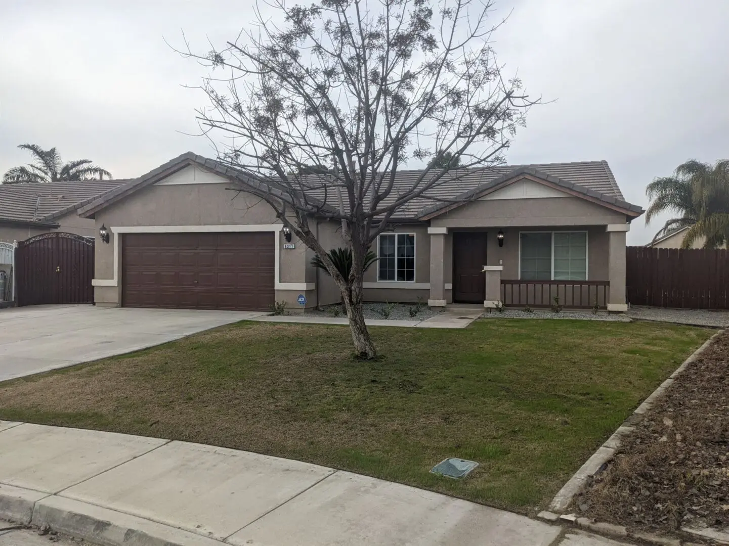 A house with a tree in front of it